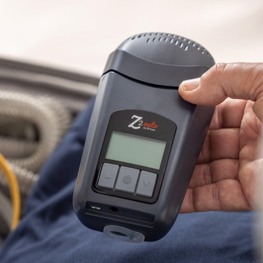 Breas Z2 Travel CPAP device in hand