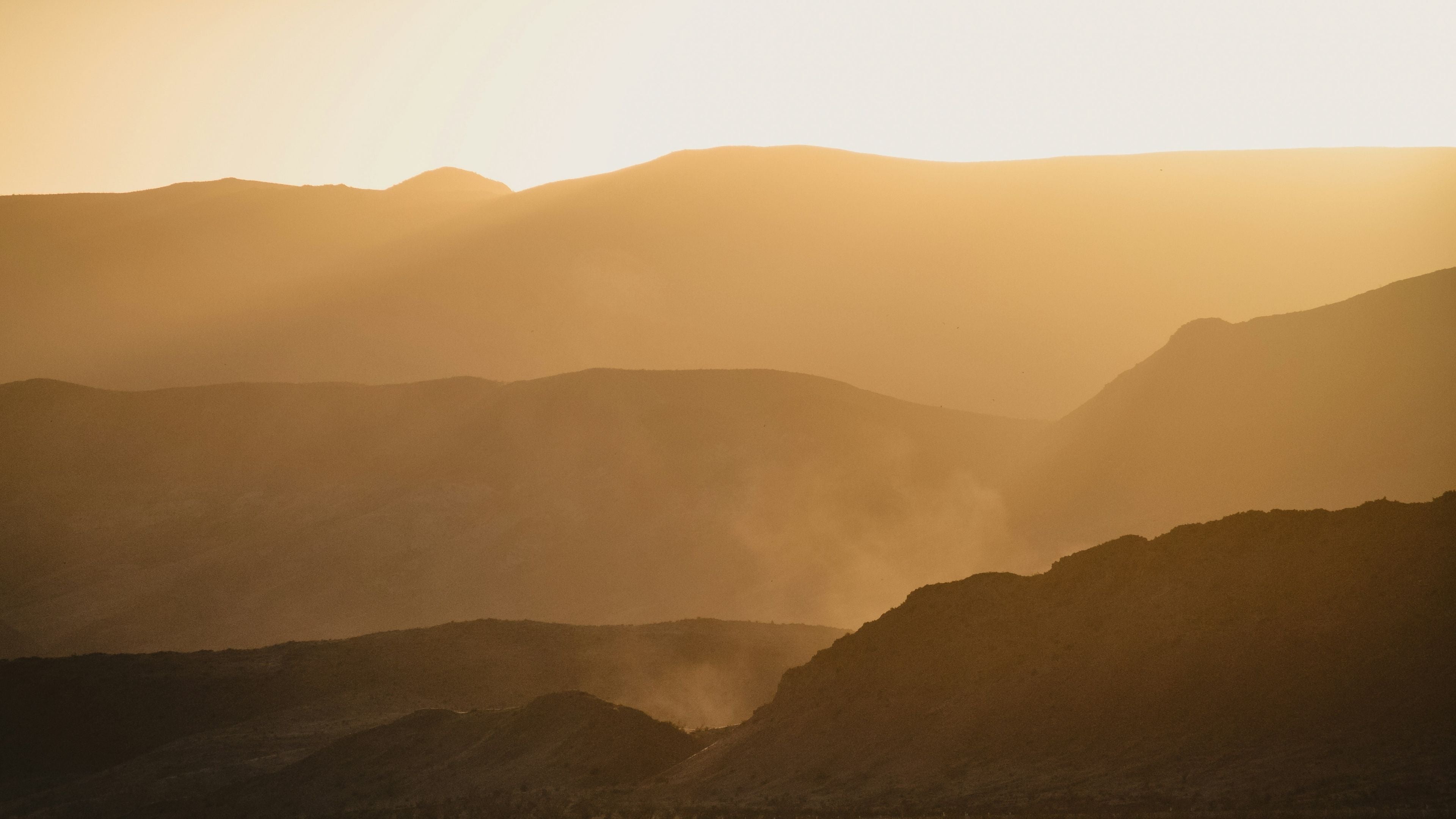 Mountains with yellow hue sunrise
