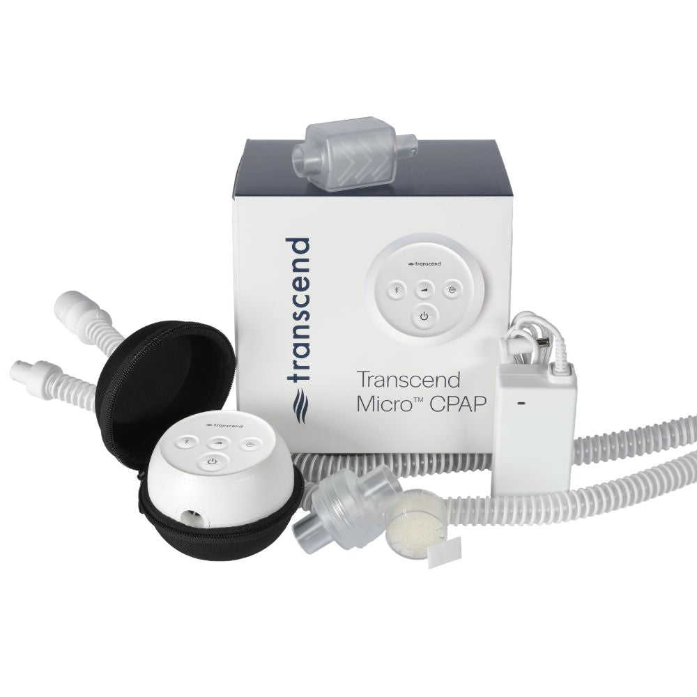 Components included with the Transcend Micro 510 CPAP Machine in front of the packaging