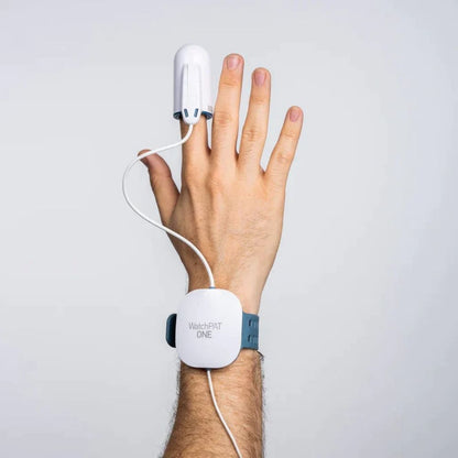 WatchPAT ONE sleep test attached onto the person's index finger and worn on the wrist like a watch
