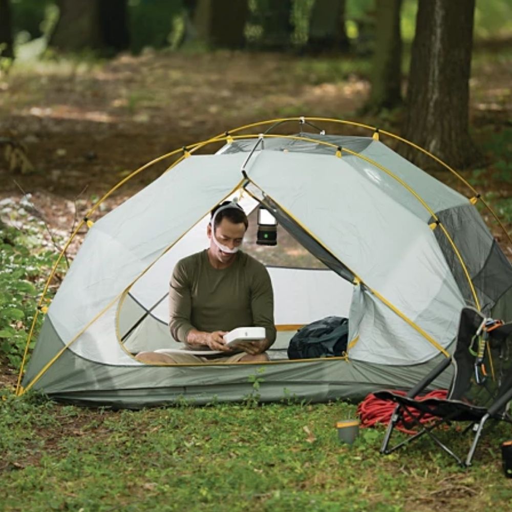 Philips DreamStation Go Overnight Battery being used in a camping tent