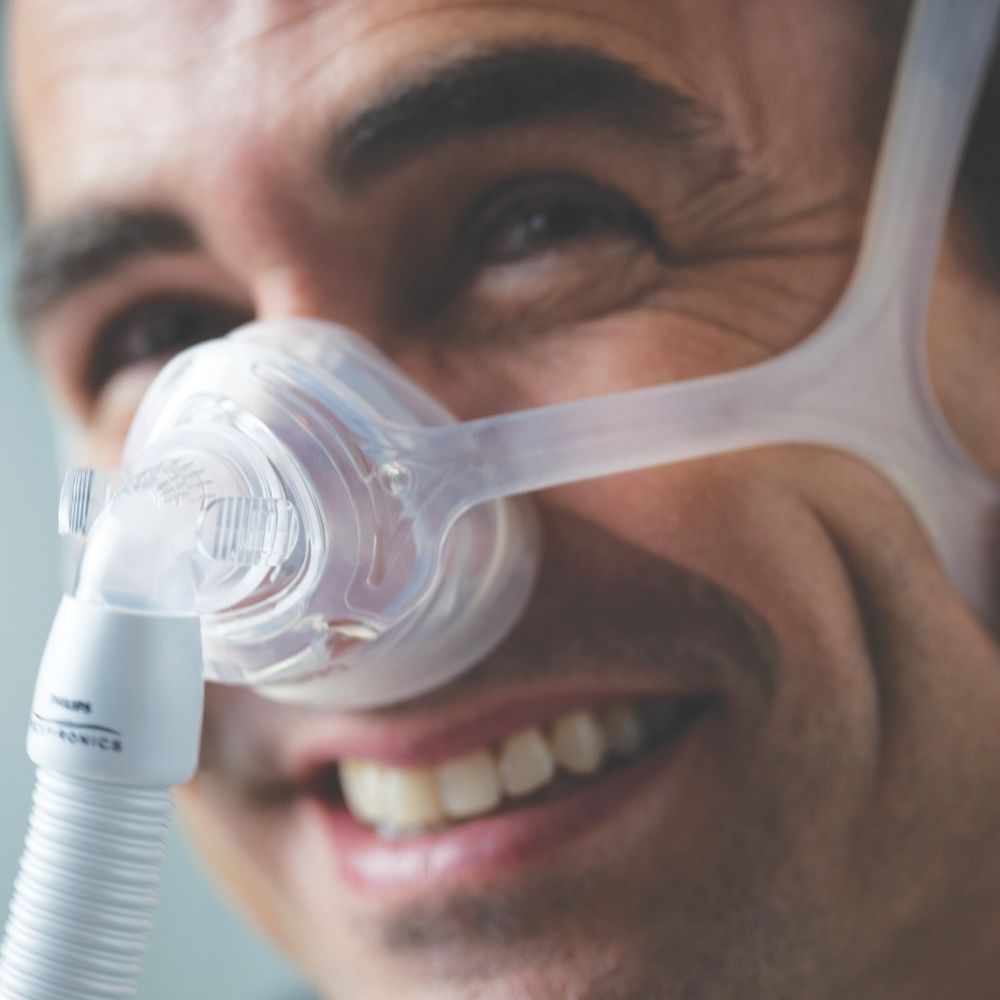 Person wearing the Philips Wisp Nasal Mask with Clear Frame