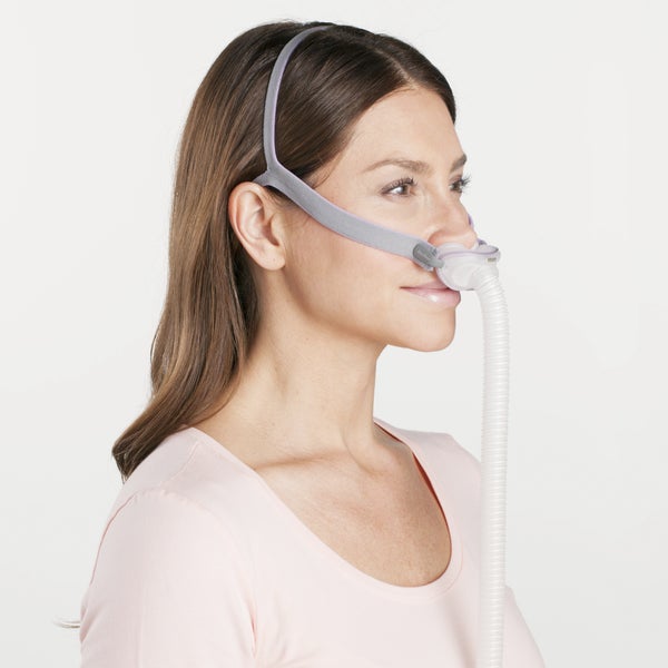 Side profile of a woman wearing the ResMed AirFit P10 for Her