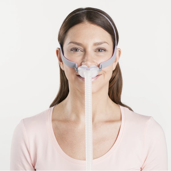 Woman wearing the ResMed AirFit P10 for Her nasal pillow CPAP mask