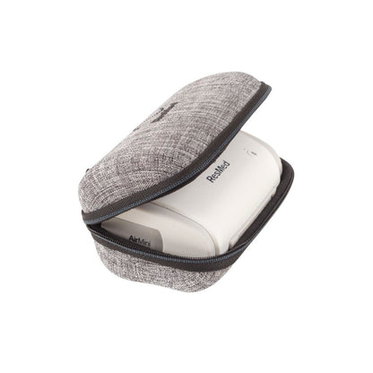 Grey textured ResMed AirMini hard carrying case pictures with an AirMini device stored inside
