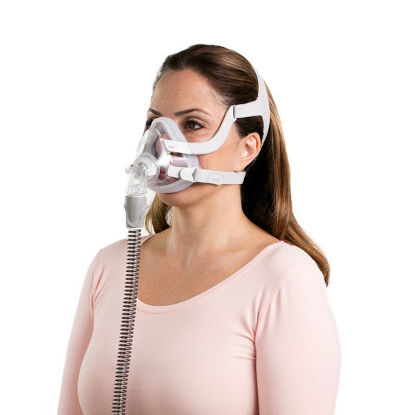 Woman wearing the ResMed AirTouch N20 for Her Nasal CPAP Mask with tube