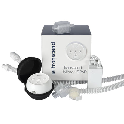 Components included with the Transcend Micro 510 CPAP Machine in front of the packaging
